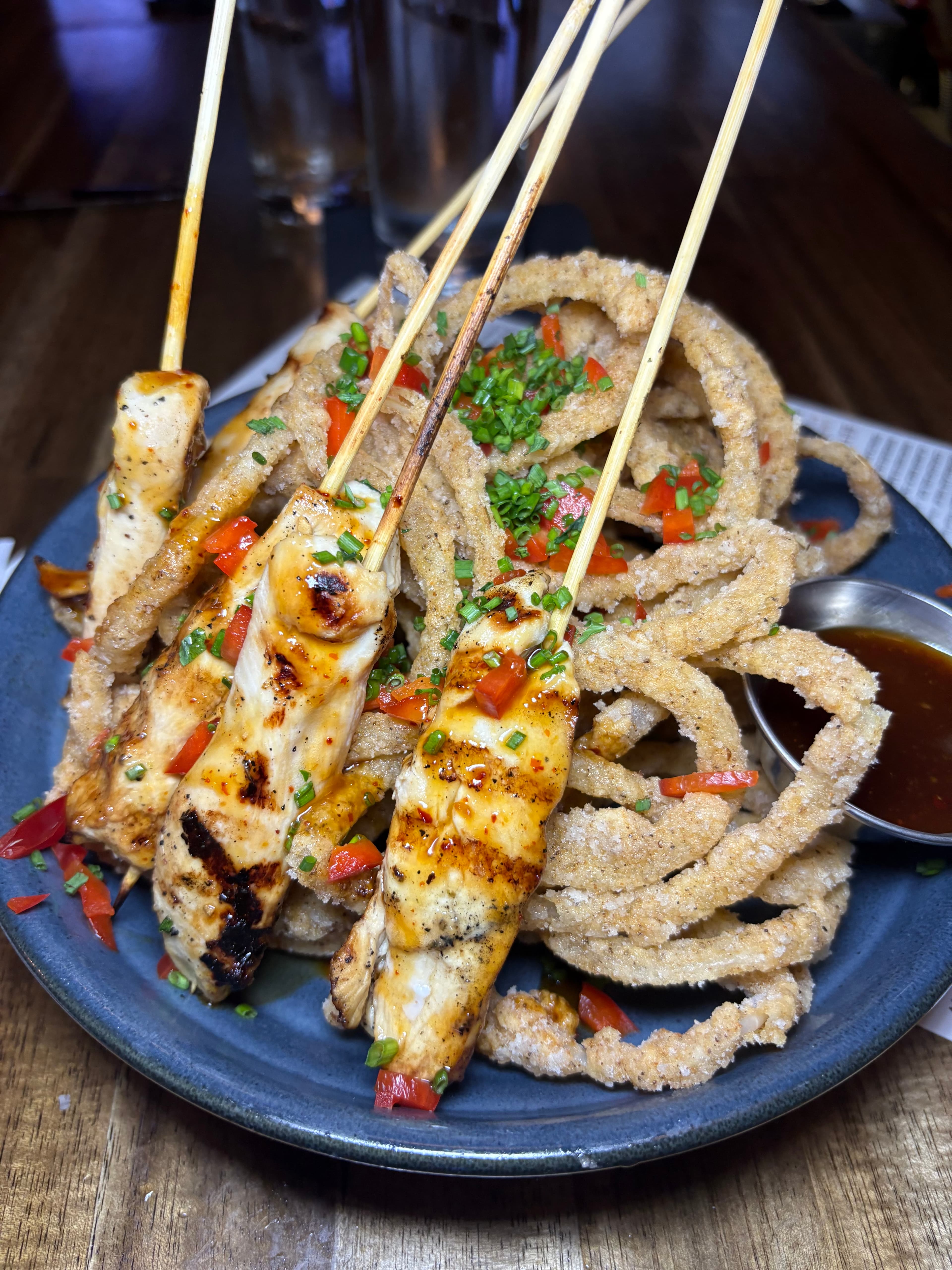Corned beef sandwich with coleslaw and pickles on rye bread at waterfront location
