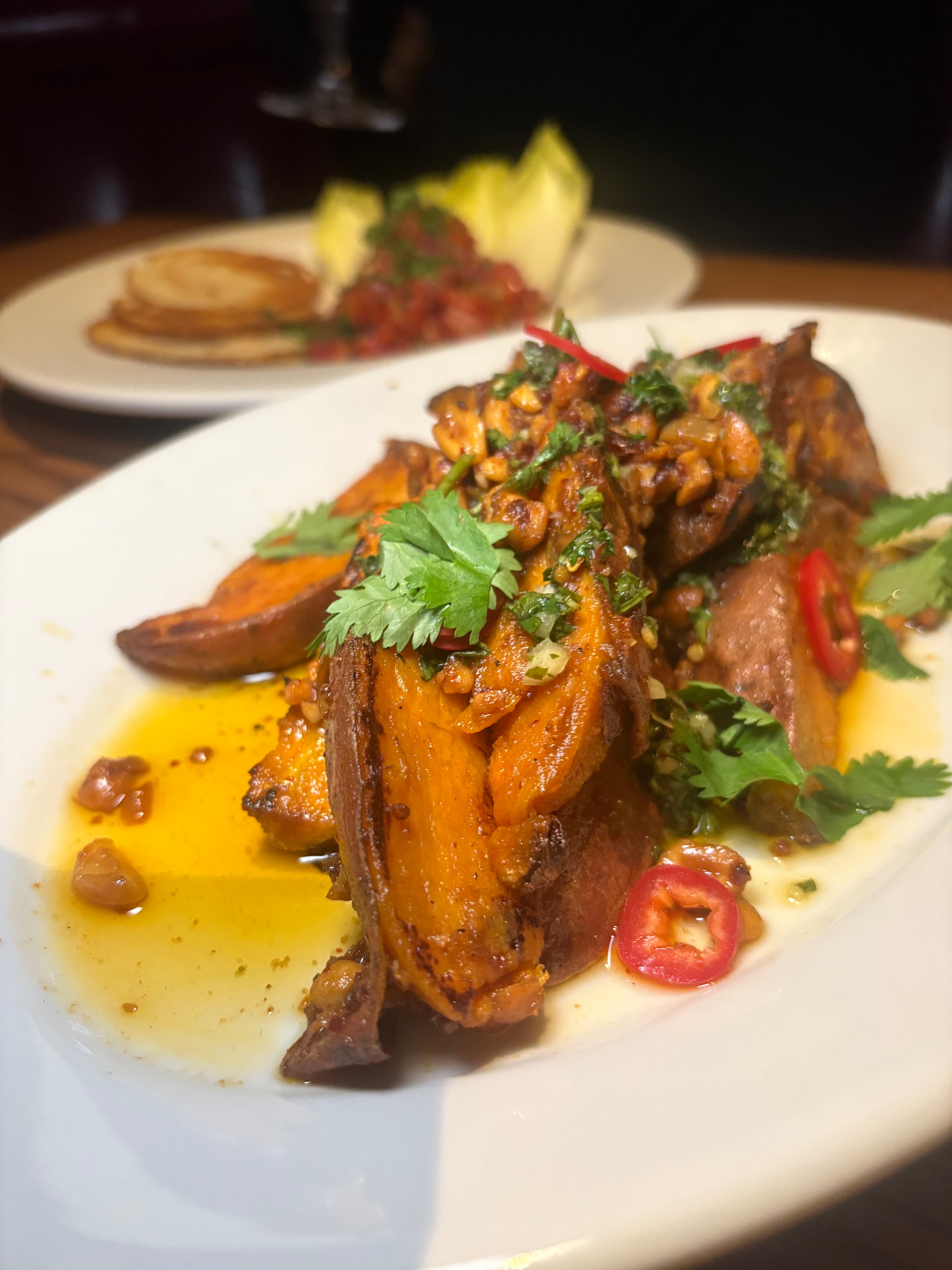 Crispy sushi rolls topped with fresh jalapeños and drizzled with savory sauce