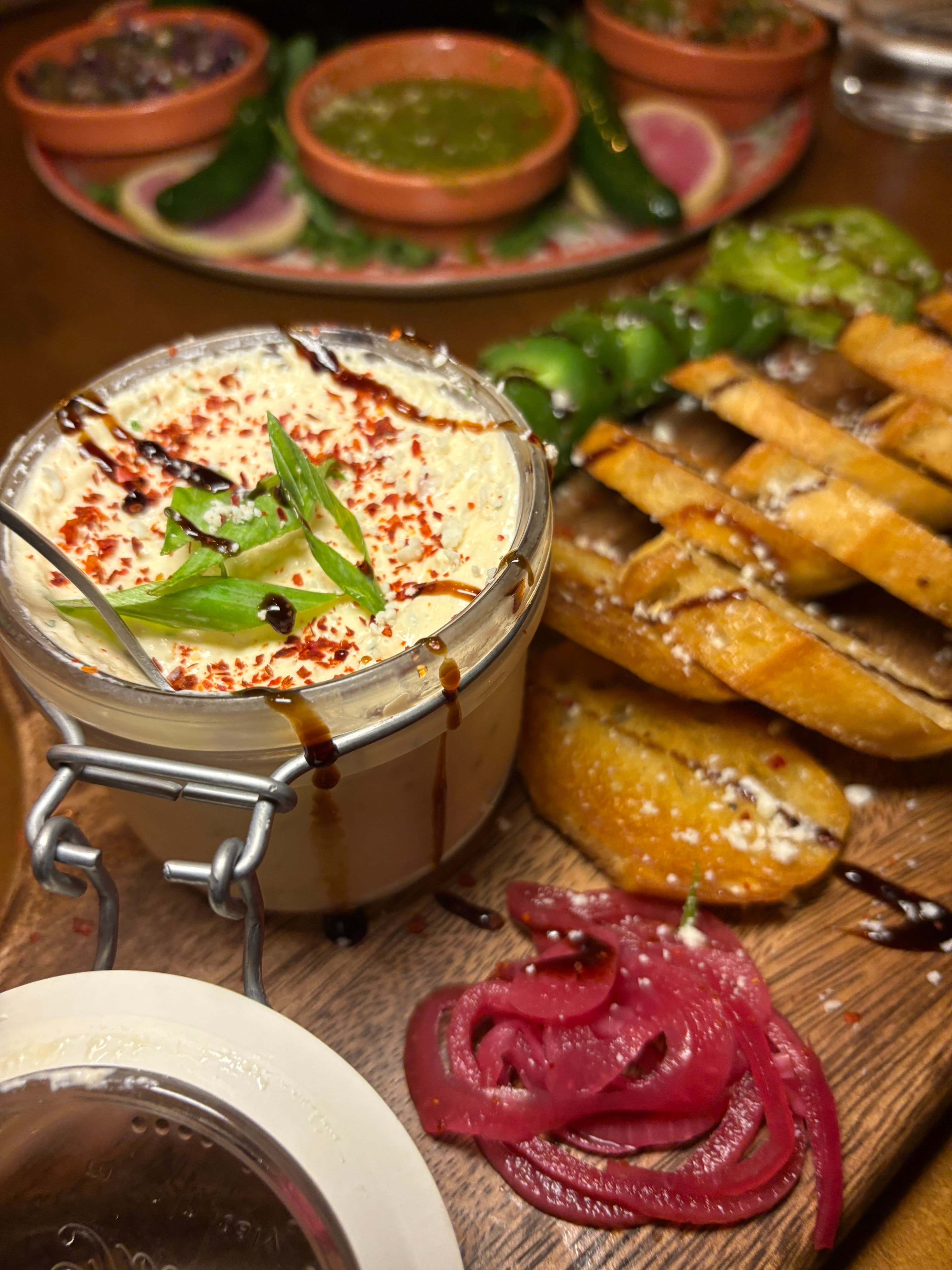 Grilled chicken skewers with crispy onion rings and signature seasonings